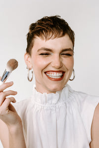 Model holding Ere Perez brush
