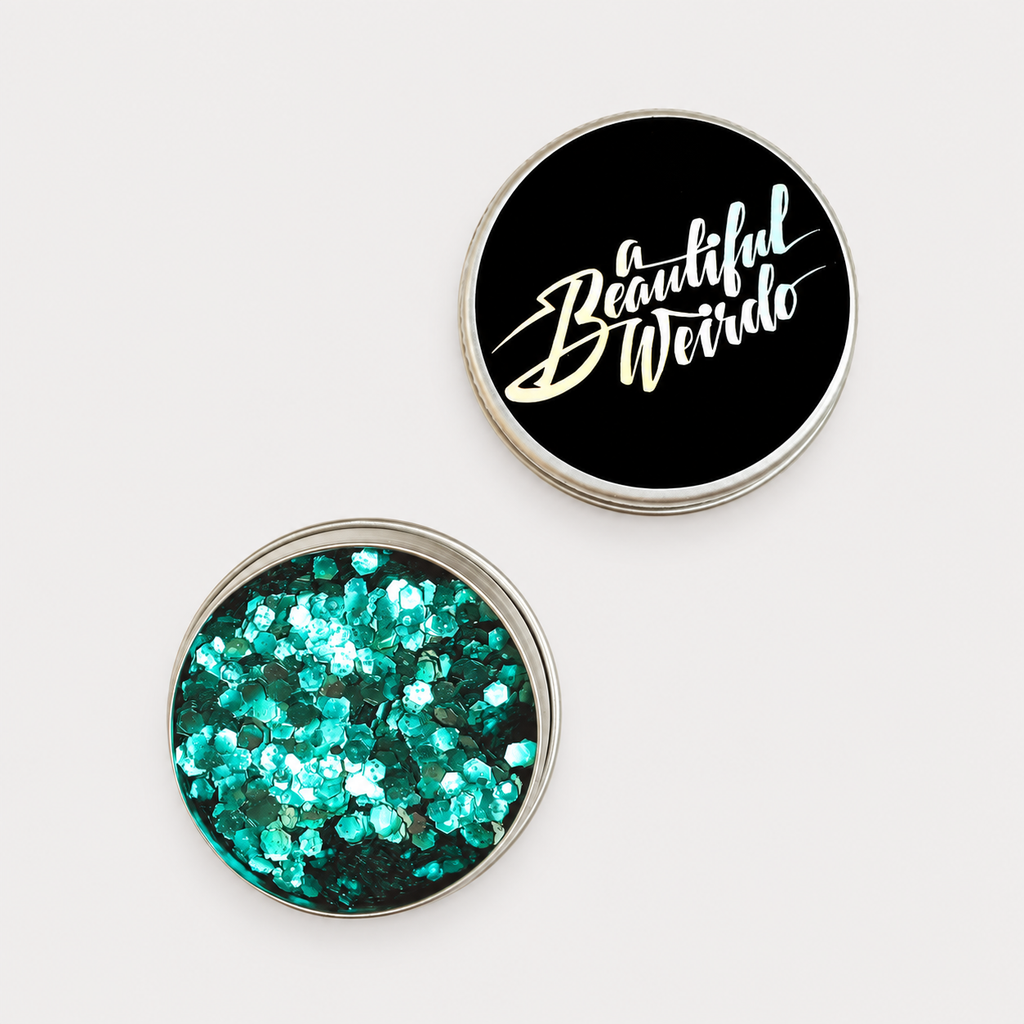 A Beautiful Weirdo Cosmic Siren Green Eco Glitter — tin and lid on pale grey