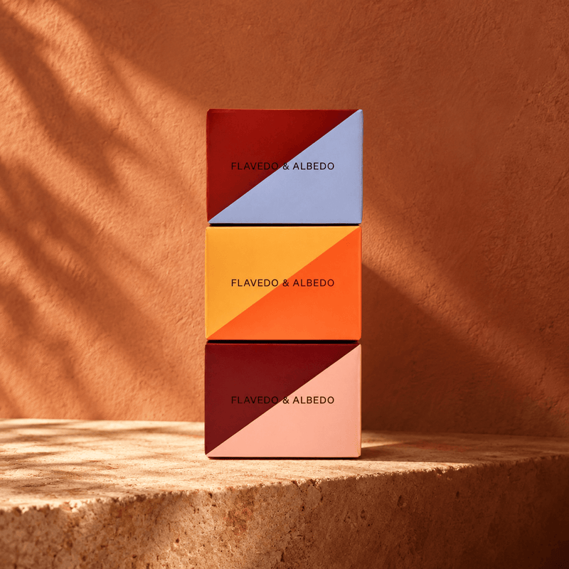 Flavedo & Albedo dew range packaging on terracotta background