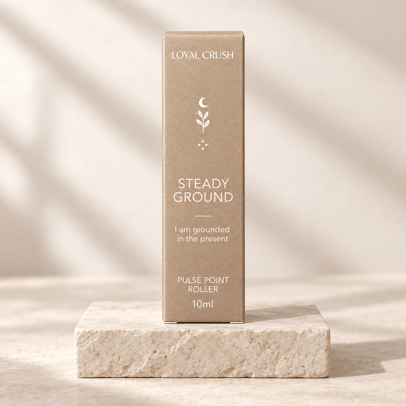 Loyal Crush steady ground pulse point roller packaging on pale stone
